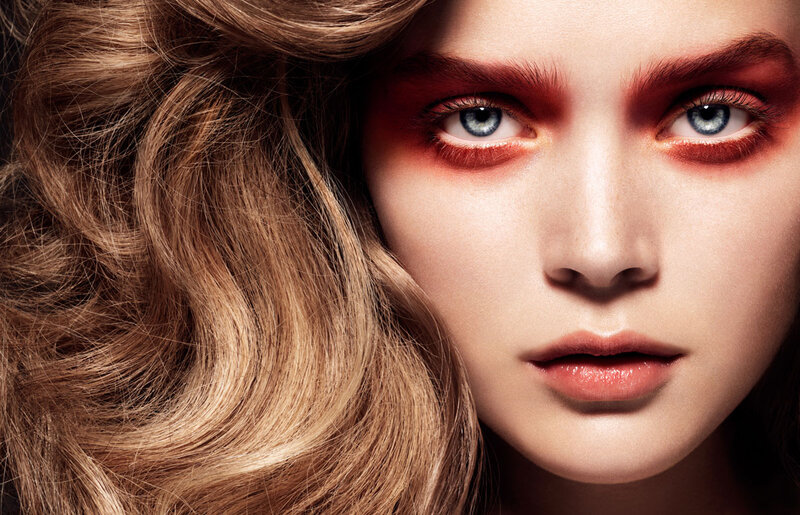 Woman with Red Eye Makeup — Brown