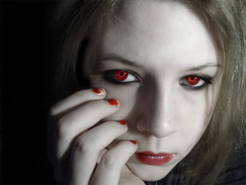 woman with red eyes and nails