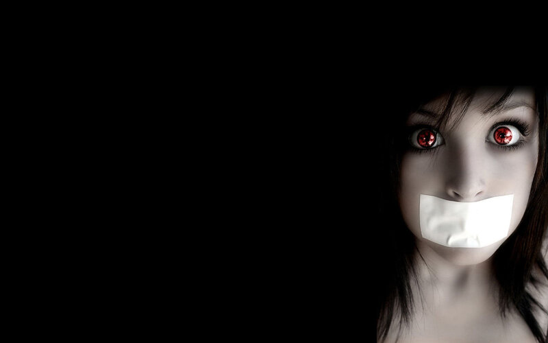 woman with red eyes and tape