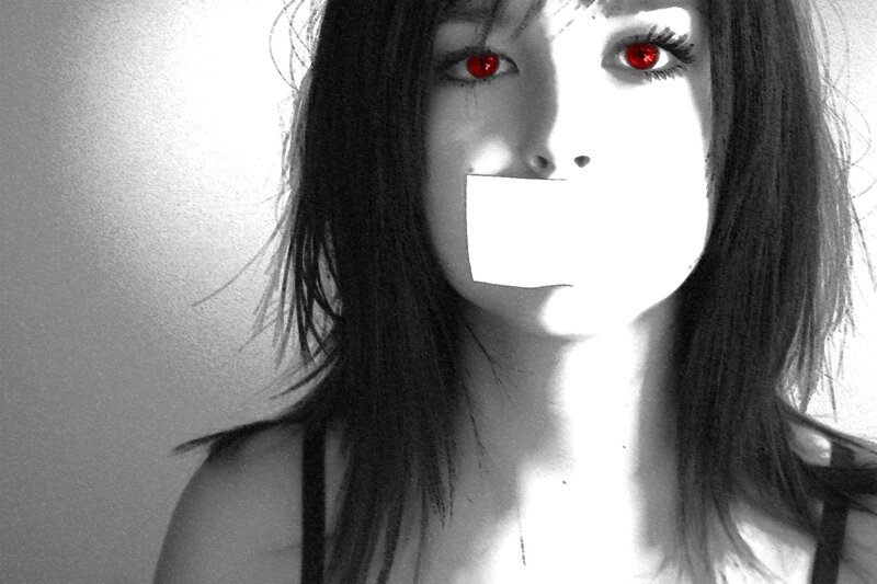 woman with red eyes and tape