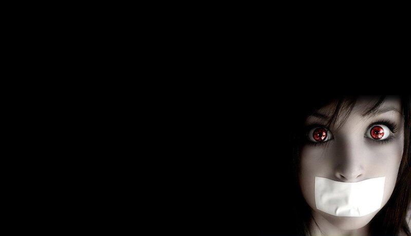 woman with red eyes and tape