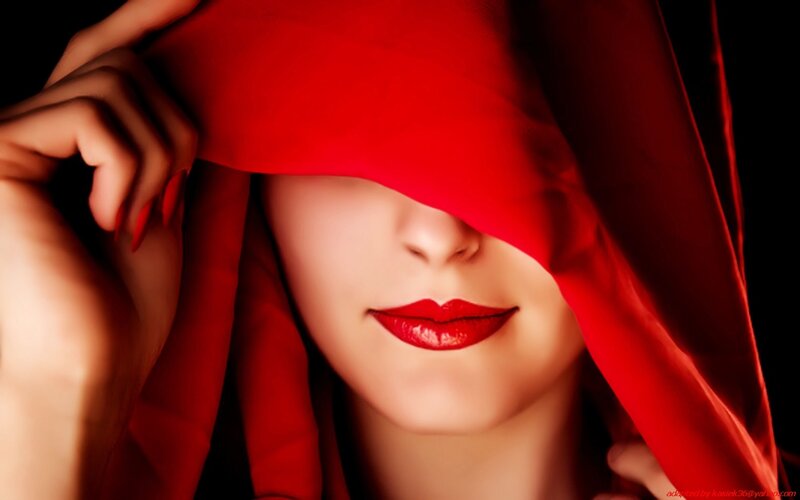 woman with red fabric covering face