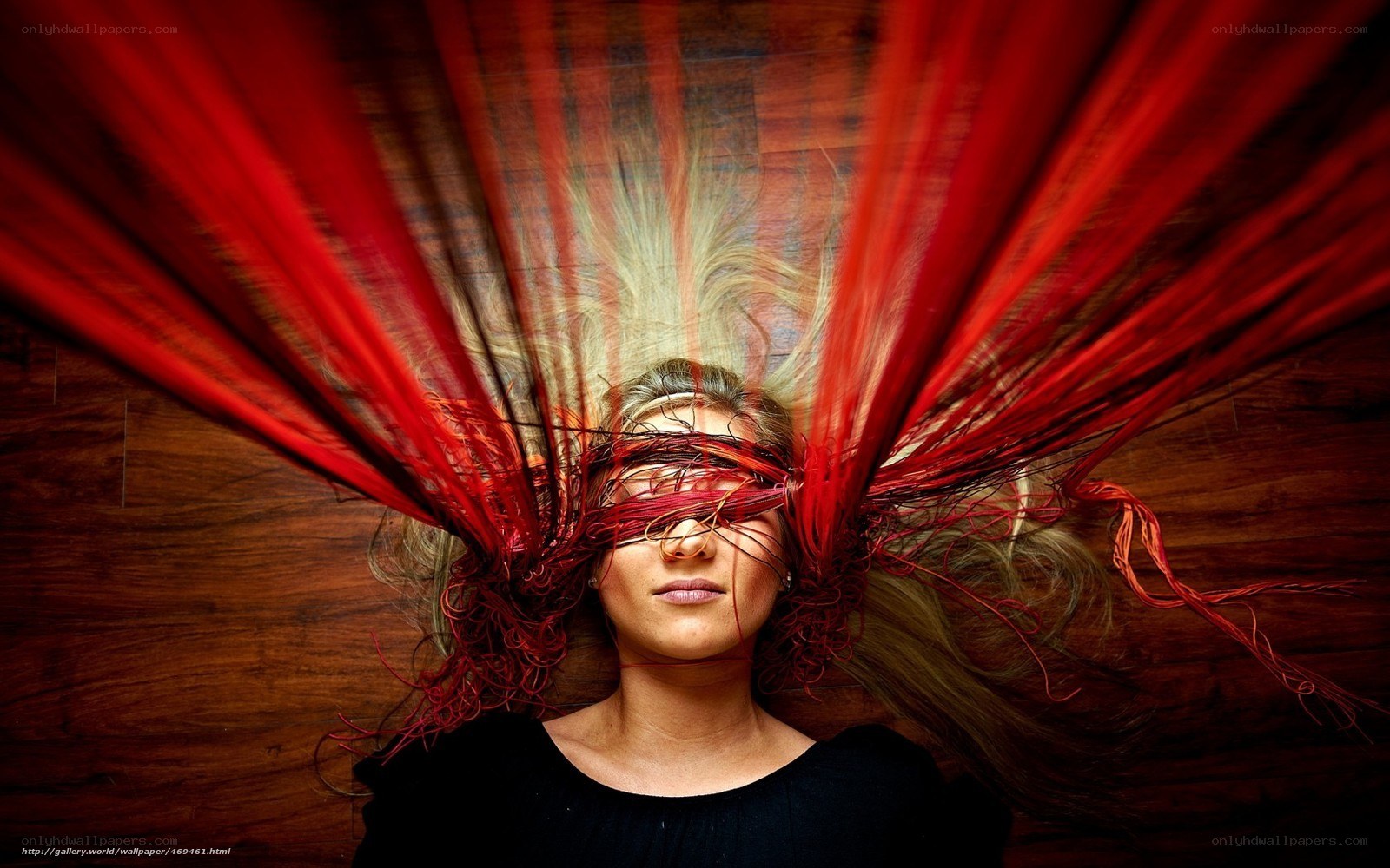 woman with red fabric wings