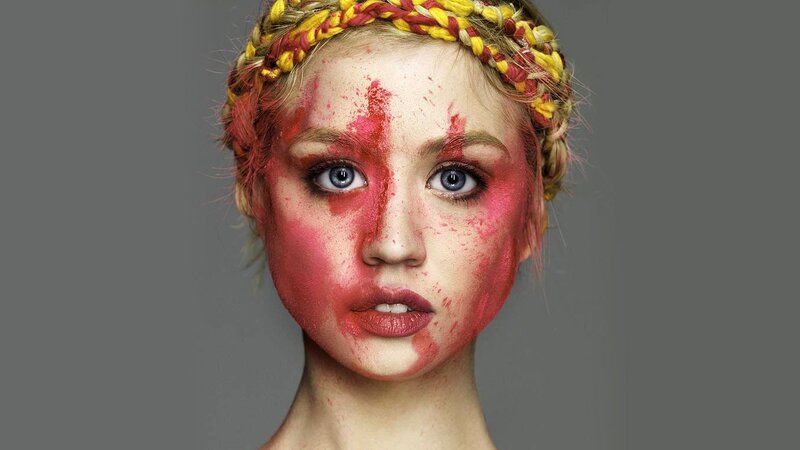Woman with Red Face Paint — Dramatic, Photograph, Braided Headband, Blue Eyes
