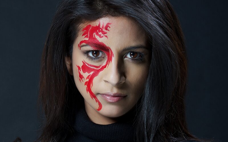 Woman with Red Face Paint — Dramatic, Photograph