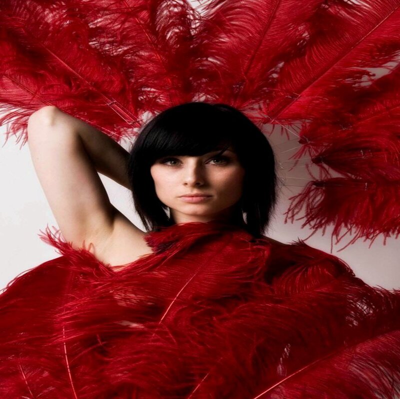 Woman with Red Feathers — Dramatic, Photograph
