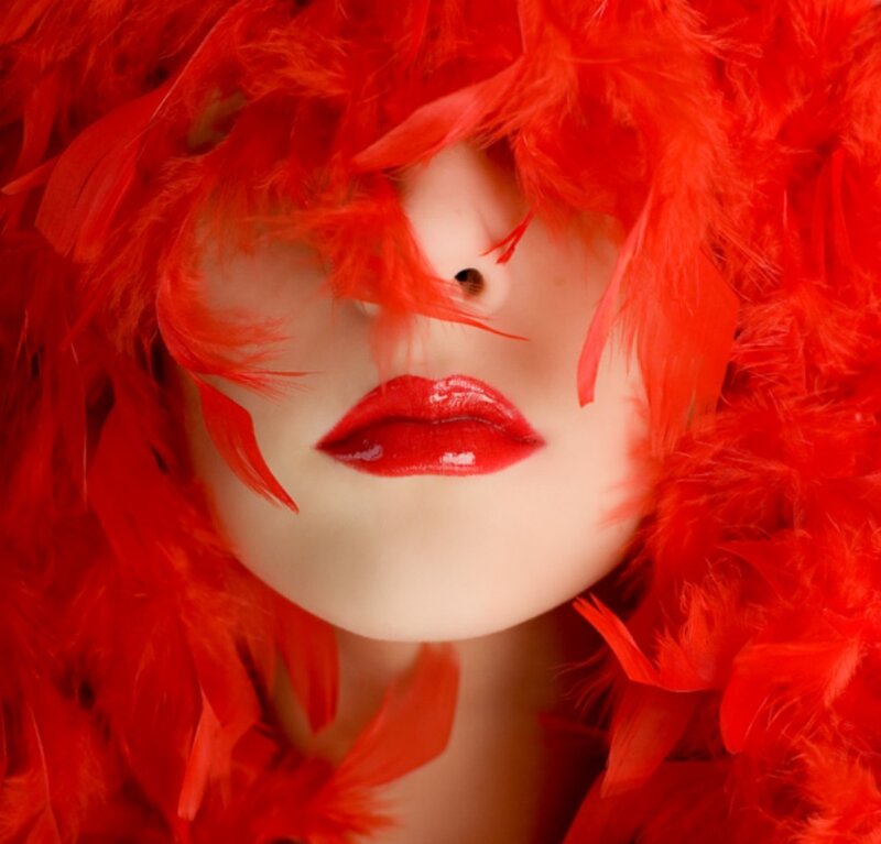 Woman with Red Feathers — Dramatic