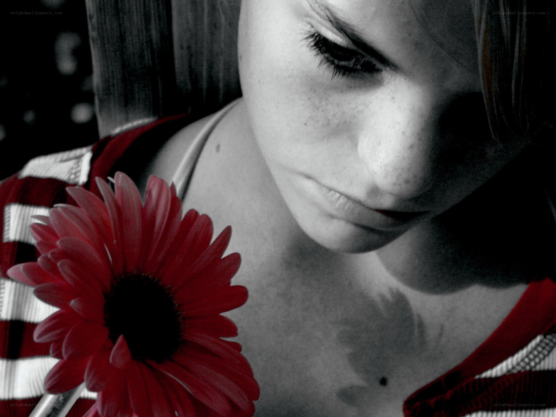 woman with red flower