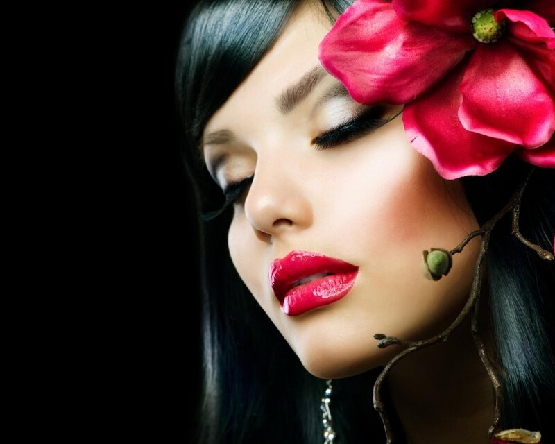 woman with red flower