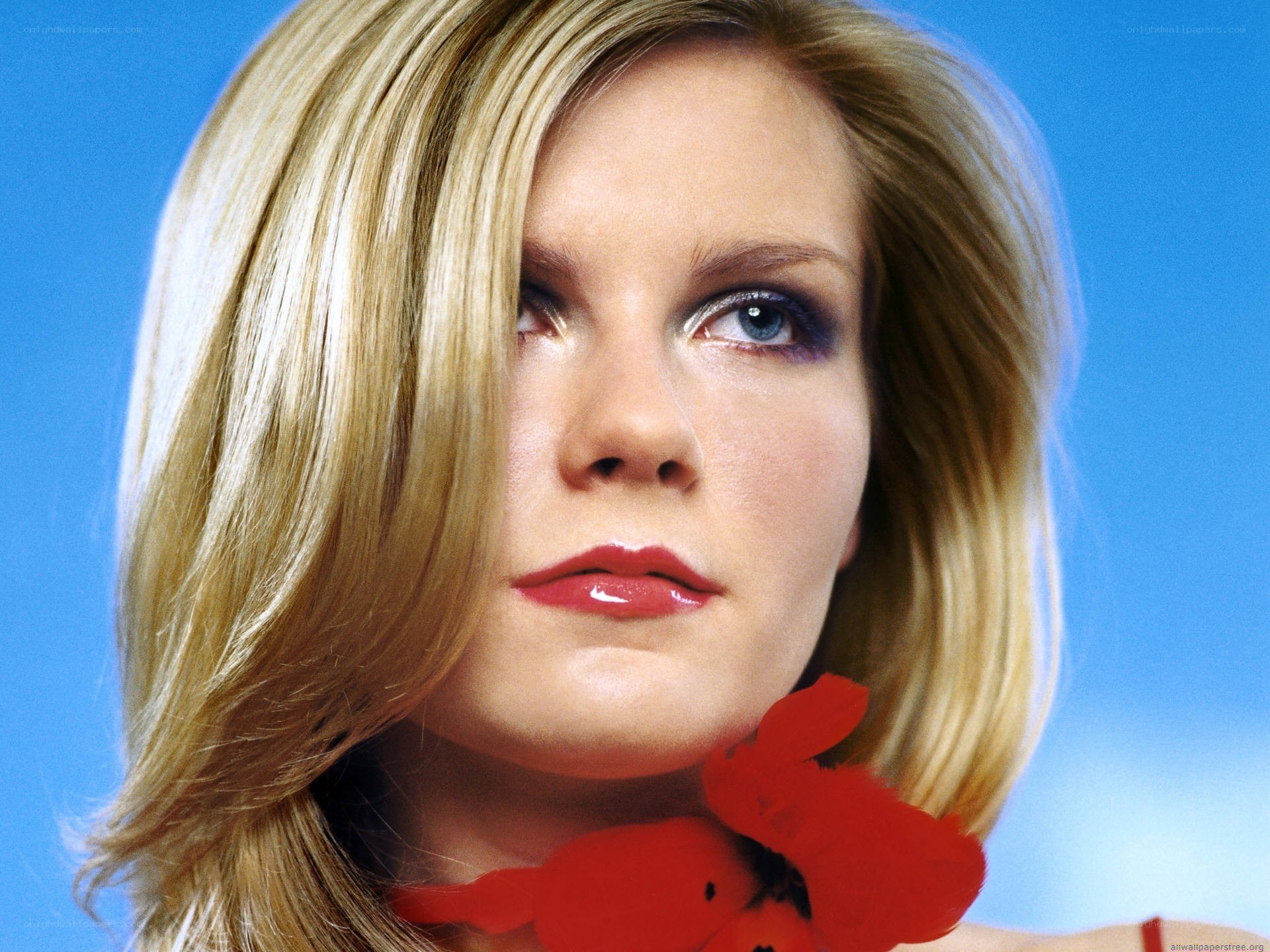 woman with red flower