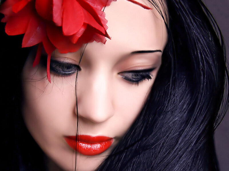 woman with red flower
