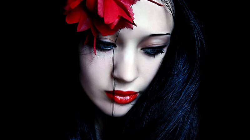 woman with red flower