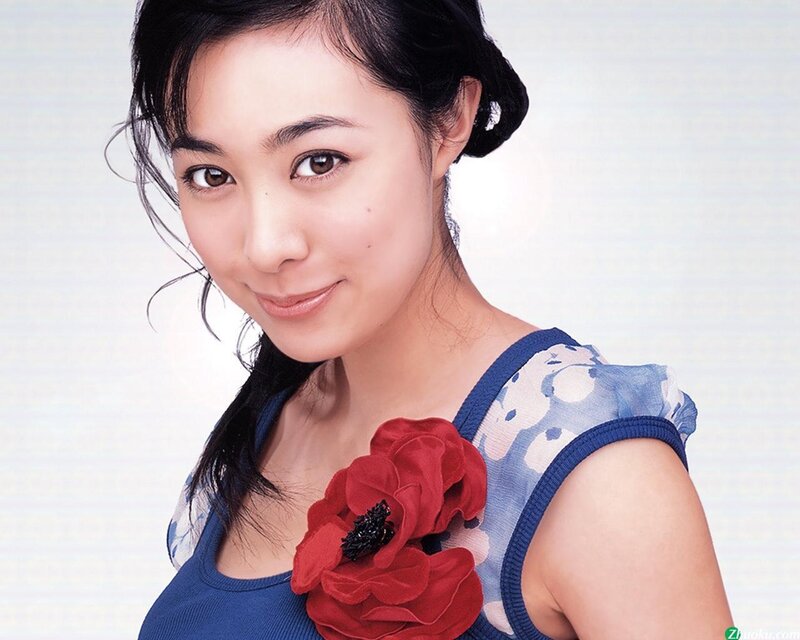 woman with red flower accessory