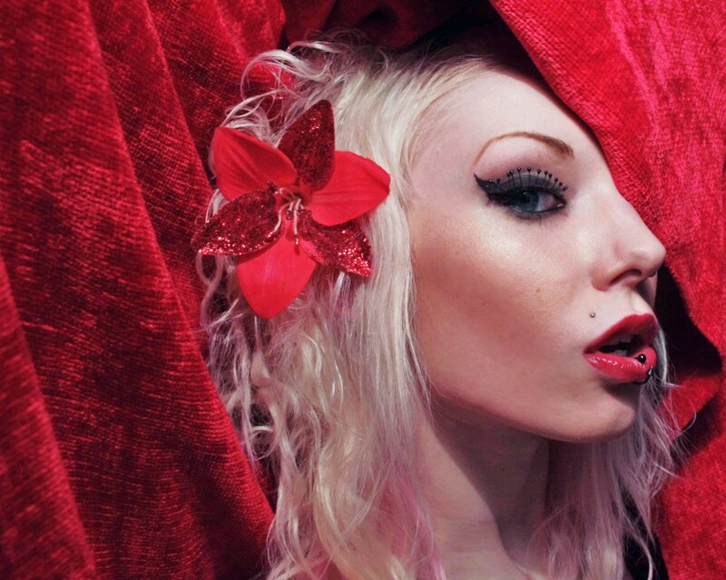 woman with red flower hair accessory