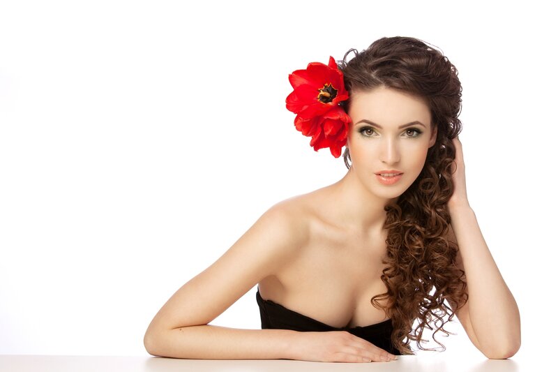 woman with red flower in hair