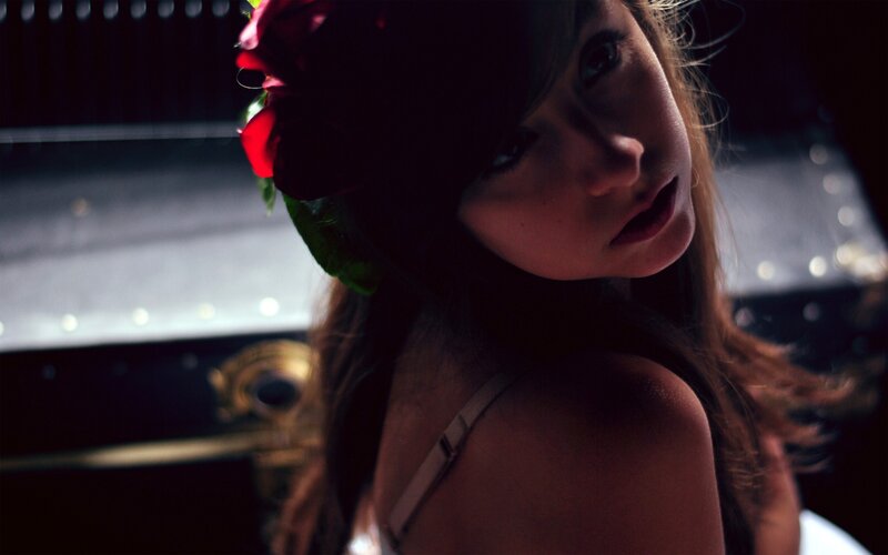 woman with red flower in hair