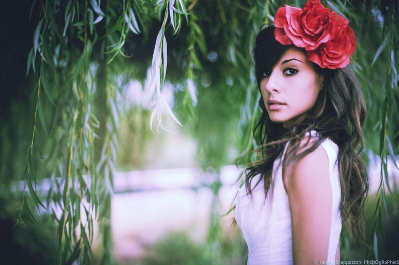 woman with red flower in hair