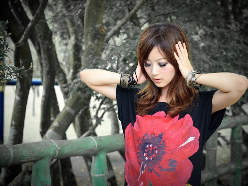woman with red flower shirt