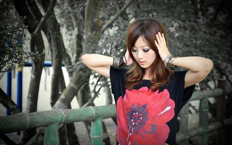 woman with red flower shirt