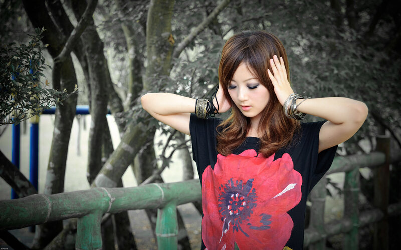 woman with red flower t-shirt