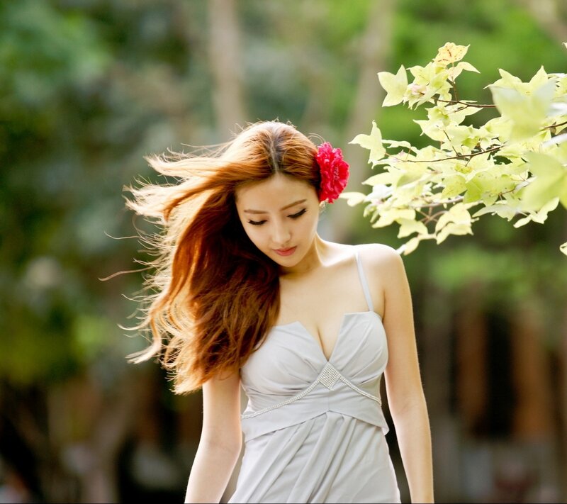 Woman with Red Flower — White, Serene