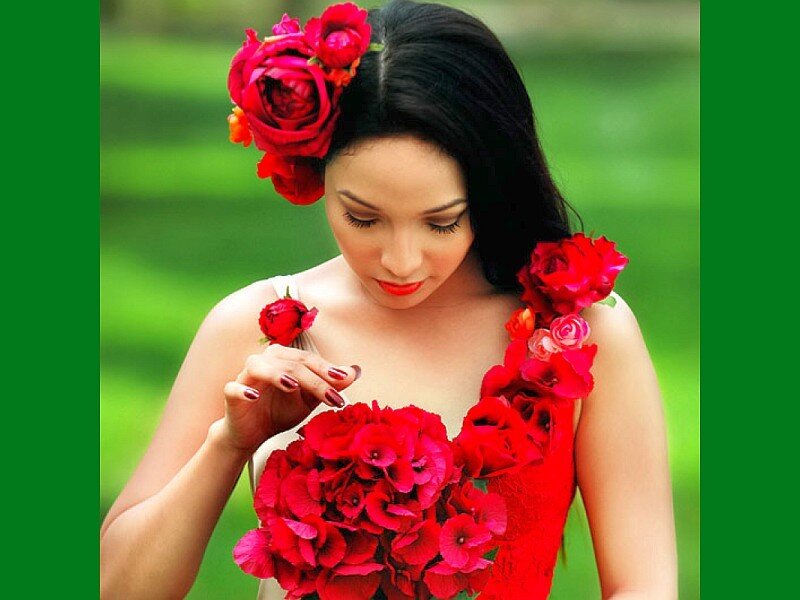 woman with red flowers