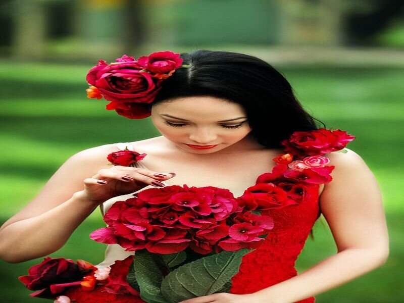woman with red flowers