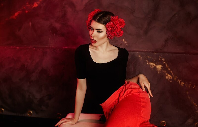 Woman with Red Flowers — Dramatic, Photograph, Black Top
