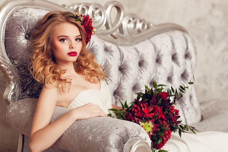 Woman with Red Flowers — Dramatic, Photograph, Couch
