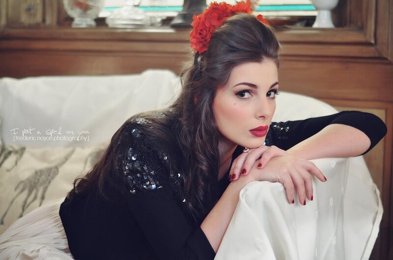 woman with red flowers in hair
