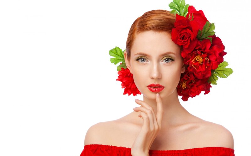 woman with red flowers in hair