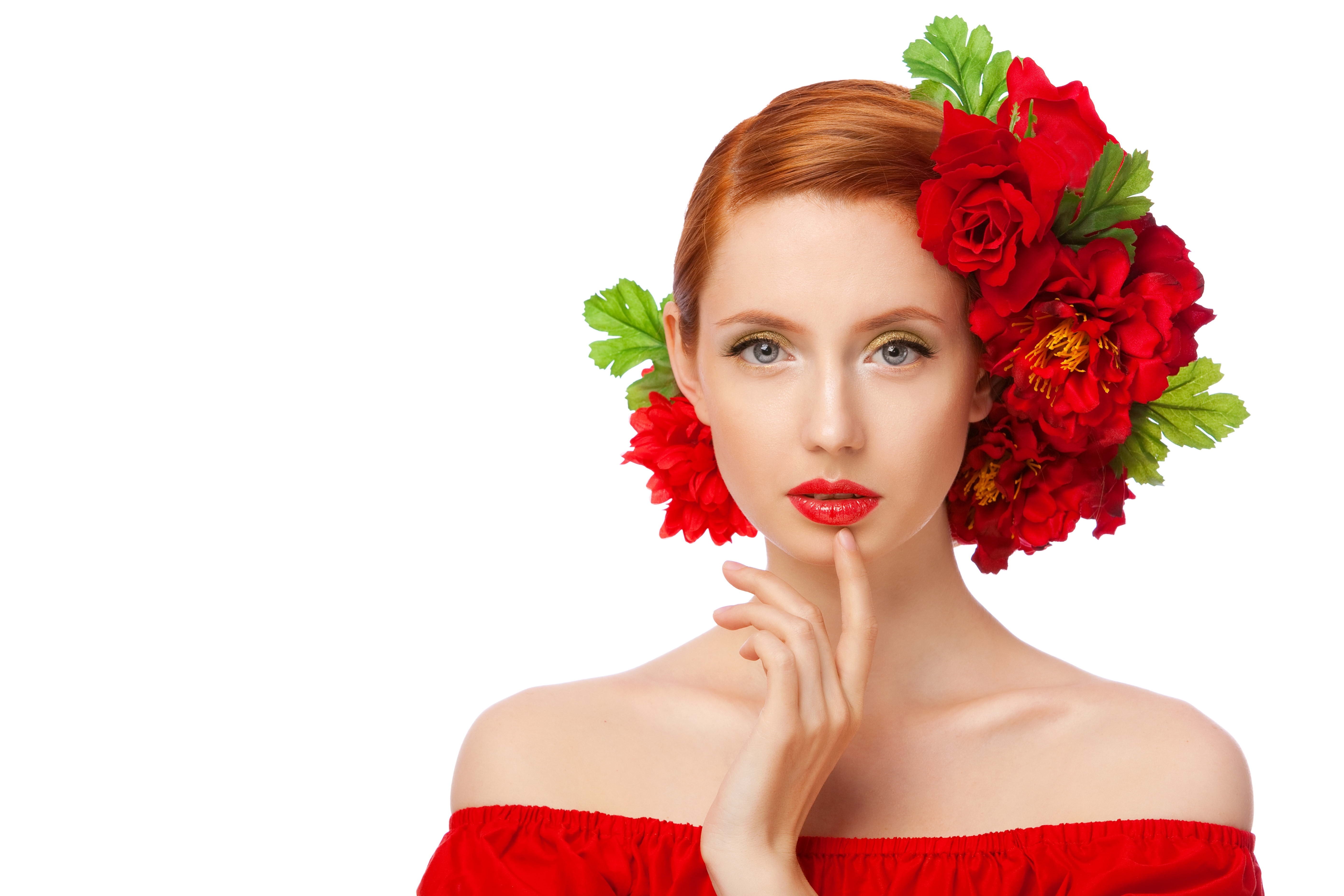 woman with red flowers in hair