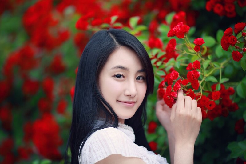 Woman with Red Flowers — Serene, Summer