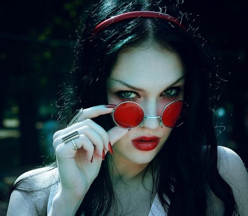 Woman with Red Glasses — Dramatic