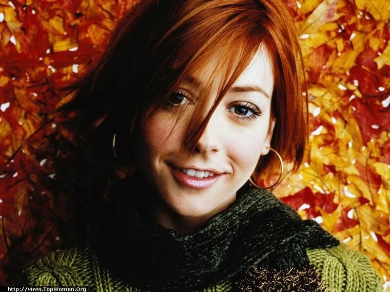 woman with red hair and autumn leaves