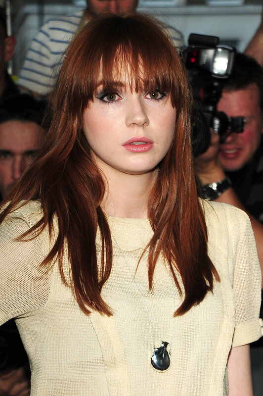woman with red hair and bangs