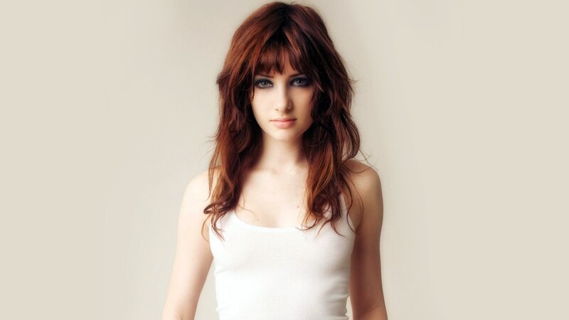 woman with red hair and bangs