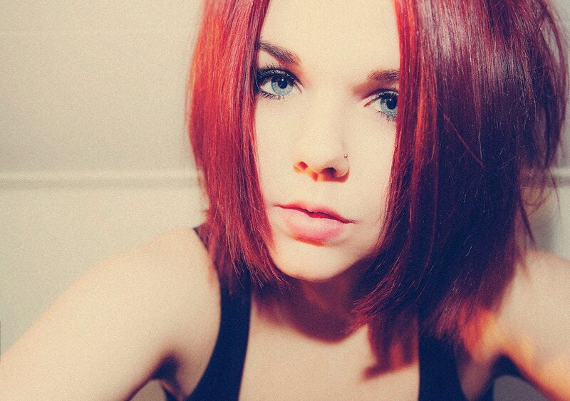 woman with red hair and blue eyes