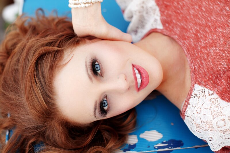 woman with red hair and blue eyes