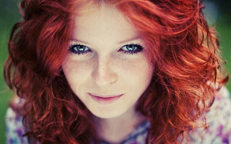 woman with red hair and blue eyes