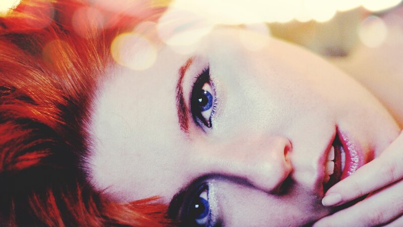 woman with red hair and blue eyes