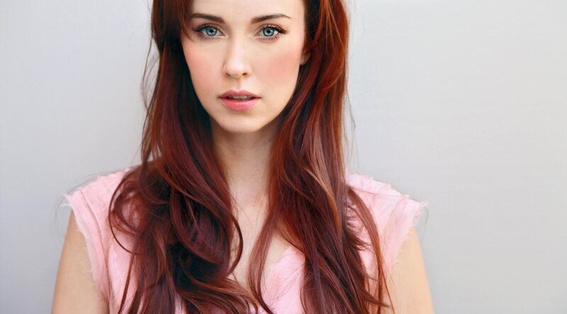 woman with red hair and blue eyes