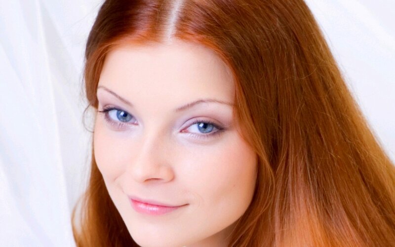 woman with red hair and blue eyes