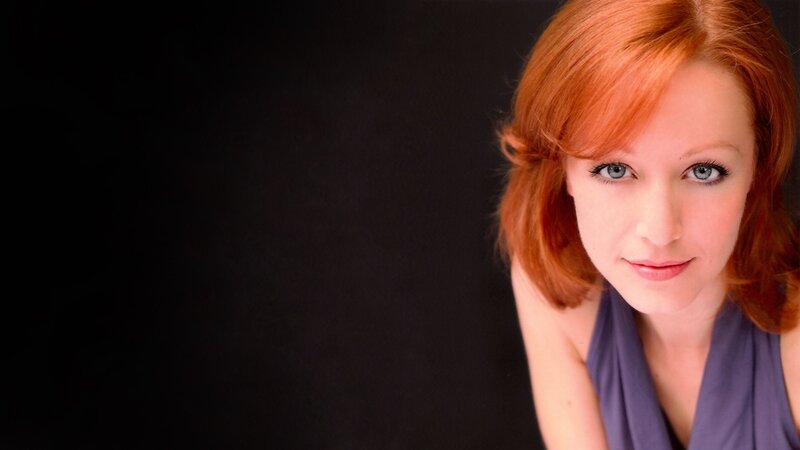 woman with red hair and blue eyes