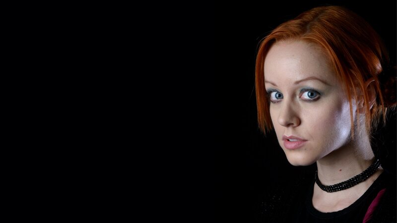 woman with red hair and blue eyes
