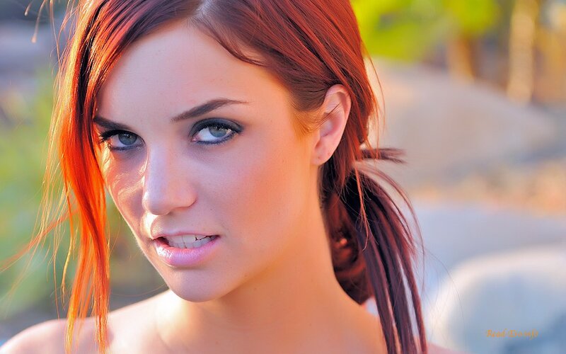 woman with red hair and blue eyes
