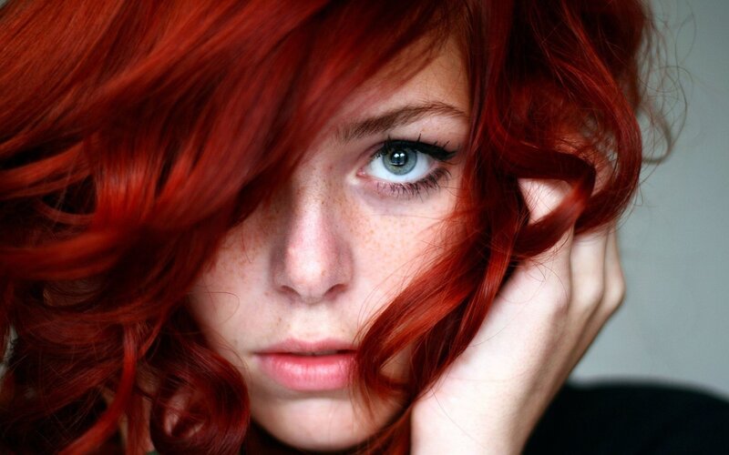 woman with red hair and blue eyes