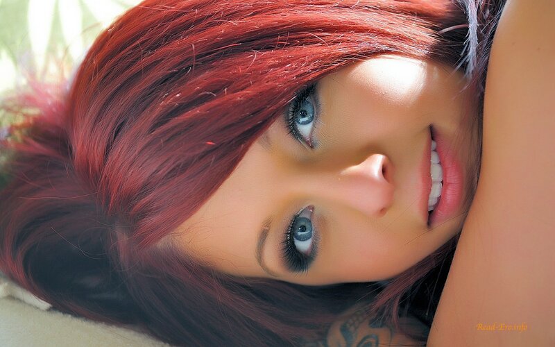 woman with red hair and blue eyes