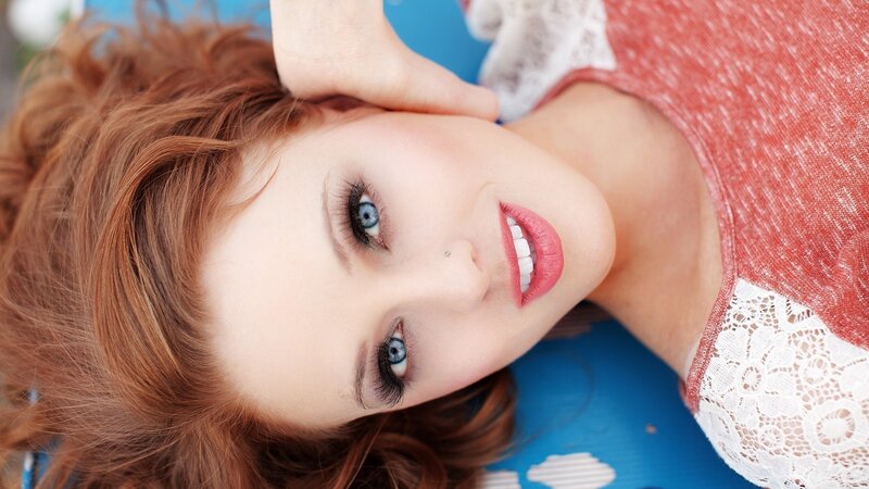 woman with red hair and blue eyes