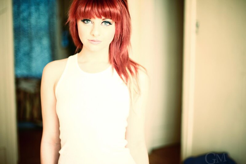 woman with red hair and blue eyes